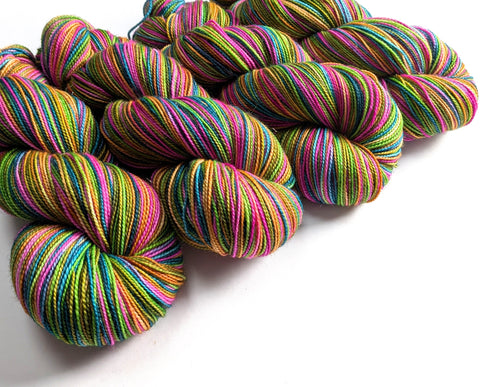 Colorful skeins of yarn on a white background