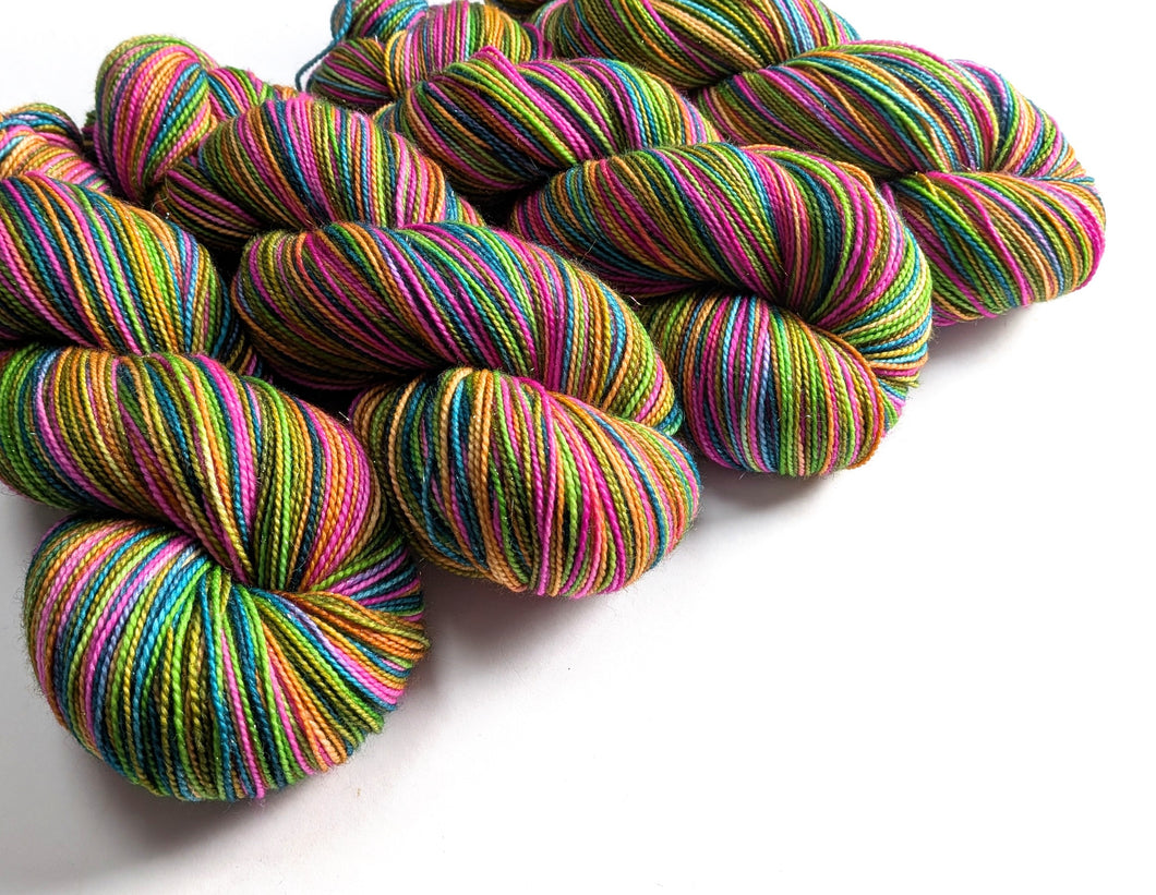 Colorful skeins of yarn on a white background
