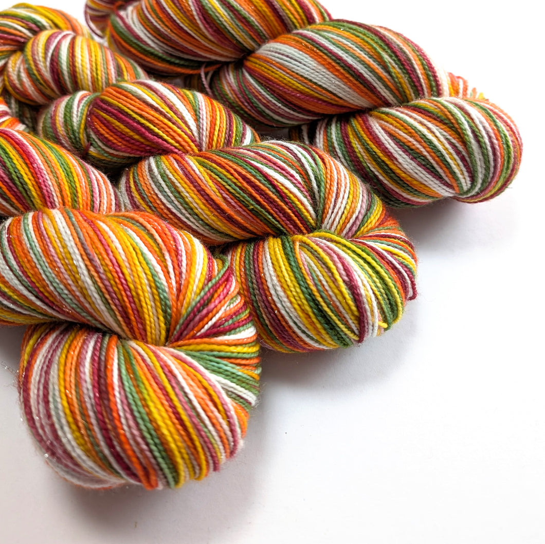 Multicolored skeins of yarn on a white background