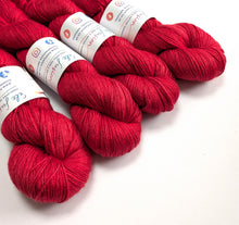 Load image into Gallery viewer, Red on baby camel/silk 4ply/fingering weight yarn.
