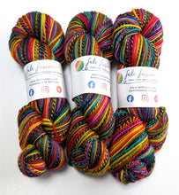 Load image into Gallery viewer, Three skeins of multicolored yarn with labels on a white background
