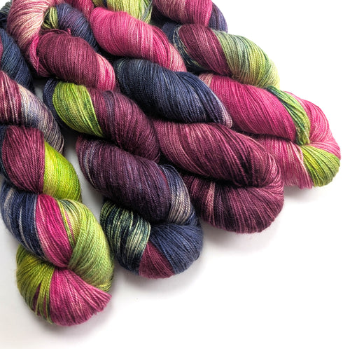Multicolored yarn skeins on a white background