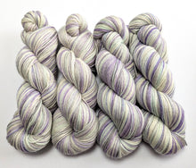 Load image into Gallery viewer, Four skeins of pastel yarn on a white background
