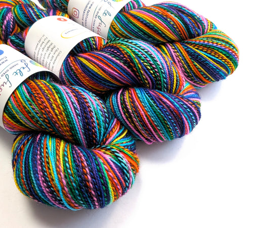 Colorful skeins of yarn with labels on a white background
