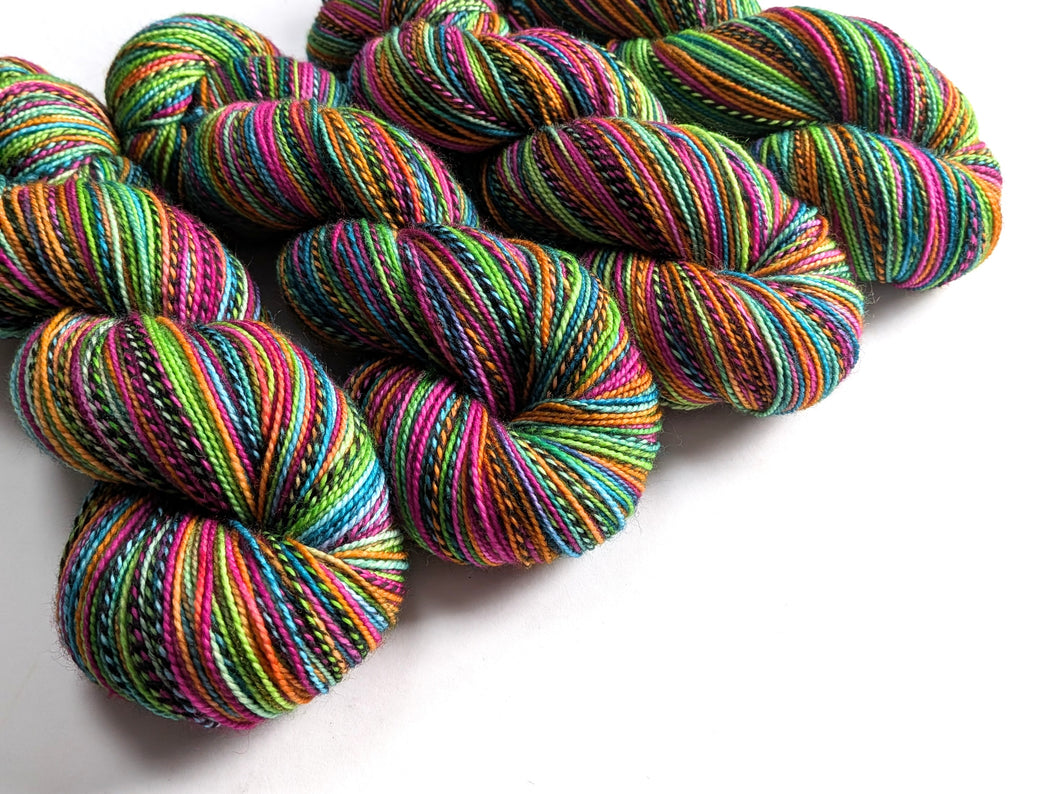 Colorful skeins of yarn on a white background