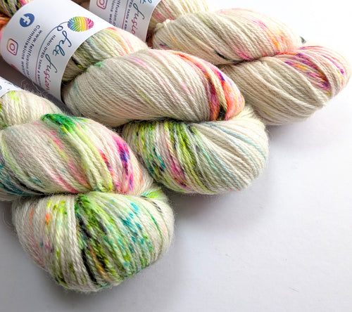 Multicolored yarn skeins with a brand label on a white background