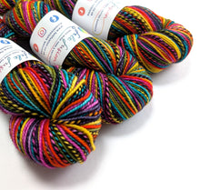 Load image into Gallery viewer, Colorful yarn skeins with labels on a white background
