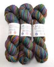 Load image into Gallery viewer, Wintertime Rainbow on 100% llama 4ply/fingering weight yarn. Grey base.
