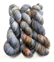 Load image into Gallery viewer, Three skeins of multicolored yarn on a white background

