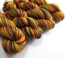 Load image into Gallery viewer, Multicolored skeins of yarn on a white background
