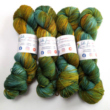Load image into Gallery viewer, Four skeins of green and yellow yarn with felt fusion labels on a white background
