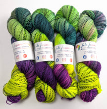 Load image into Gallery viewer, Frankenskein on high twist superwash merino/nylon "Zebra" sock yarn.
