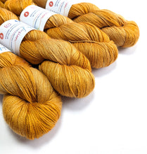 Load image into Gallery viewer, Honey on baby camel/silk 4ply/fingering weight yarn.

