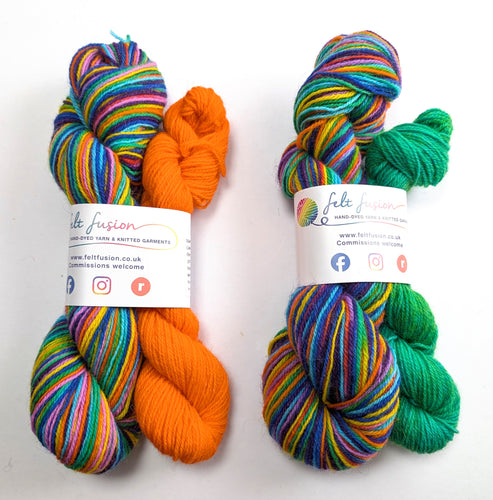 Two skeins of multicolored yarn with orange and green accents, labeled 'felt fusion', on a white background.