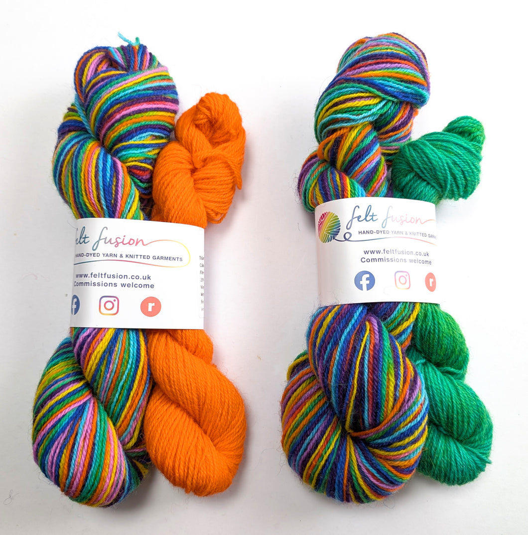 Two skeins of multicolored yarn with orange and green accents, labeled 'felt fusion', on a white background.