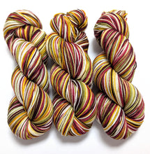Load image into Gallery viewer, Vintage Christmas on superwash merino/nylon sock yarn.

