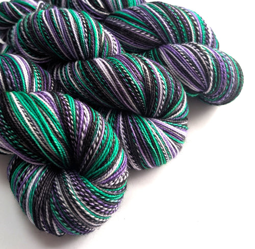 Multicolored yarn skeins on a white background