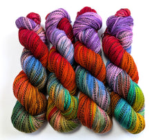 Load image into Gallery viewer, Frankenskein's Rainbow on high twist superwash merino/nylon "Zebra" sock yarn.
