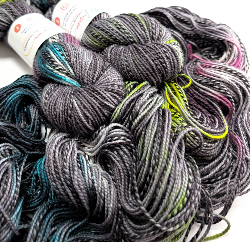 Bundles of multicolored yarn on a white background