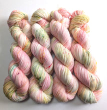 Load image into Gallery viewer, Four skeins of multicoloured yarn on a white background
