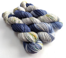Load image into Gallery viewer, Three skeins of navy and silver yarn with speckles.

