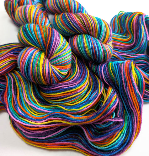 Multicolored yarn skeins on a white background