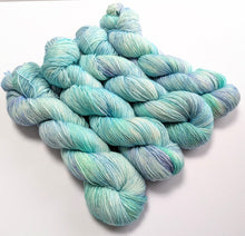 Load image into Gallery viewer, Blue and green yarn skeins on a white background
