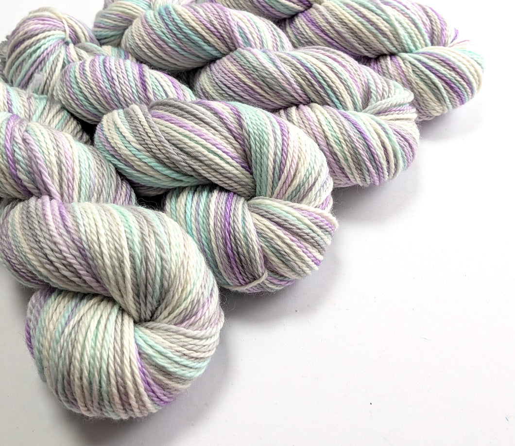 Multicolored yarn skeins on a white background