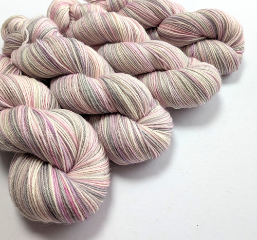 Multicolored yarn skeins on a white background
