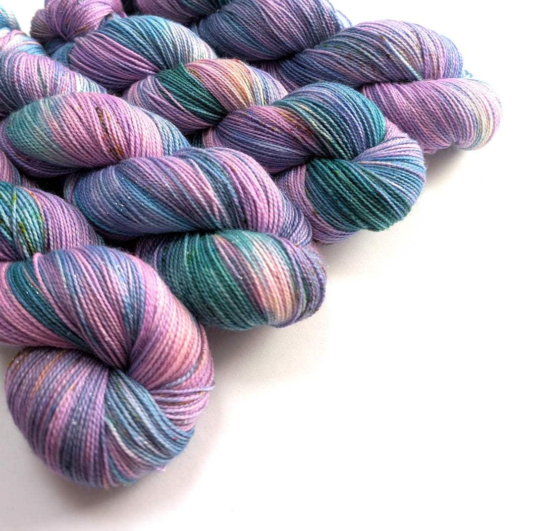 Multicolored yarn skeins on a white background