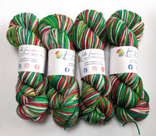 Load image into Gallery viewer, Holly Jolly Christmas hand dyed on Superwash Merino/Nylon/Sparkle sock yarn.
