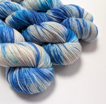 Load image into Gallery viewer, Blue and gray yarn skeins on a white background
