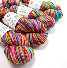 Load image into Gallery viewer, Colorful skeins of yarn with labels on a white background
