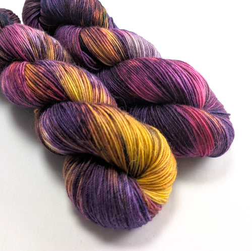 Colorful skeins of yarn on a white background