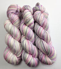 Load image into Gallery viewer, Three skeins of multicolored yarn on a white background
