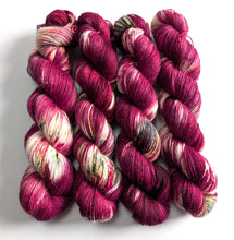 Load image into Gallery viewer, Four skeins of multicoloured yarn on a white background
