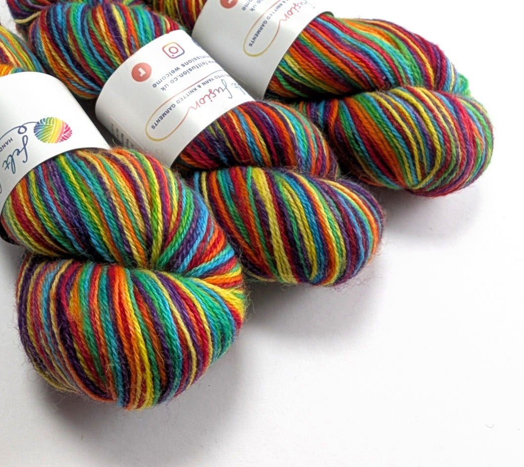 Rainbow yarn on a white background.