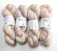 Load image into Gallery viewer, Four skeins of yarn on a white background.
