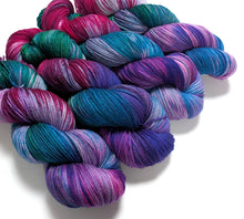 Load image into Gallery viewer, Peacock on superwash merino/cashmere/nylon sock yarn.
