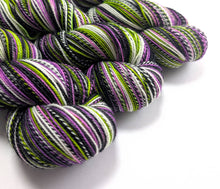 Load image into Gallery viewer, Multicolored yarn skeins on a white background
