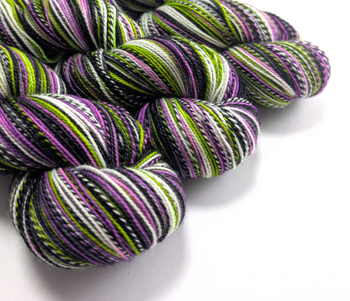 Multicolored yarn skeins on a white background