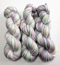 Load image into Gallery viewer, Three skeins of multicolored yarn on a white background
