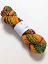 Load image into Gallery viewer, Autumn Leaves on superwash merino/cashmere/nylon DK yarn.
