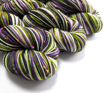 Load image into Gallery viewer, Multicolored yarn skeins on a white background
