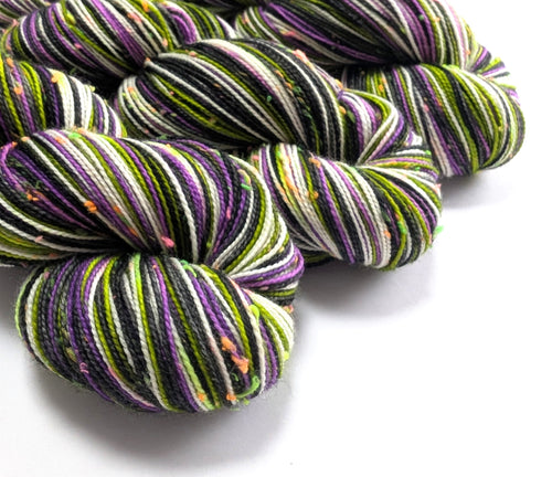 Multicolored yarn skeins on a white background