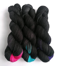 Load image into Gallery viewer, Black Like My Heart on a Superwash Merino/Nylon/Sparkle sock yarn. freeshipping - Felt Fusion
