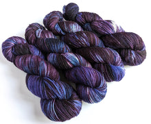 Load image into Gallery viewer, Crushed Grapes on superwash merino/nylon/sparkle sock yarn.
