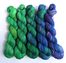 Load image into Gallery viewer, Blues and greens gradient set, sw merino/nylon sock yarn.
