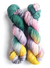 Load image into Gallery viewer, Lights of the Forest on a superwash Merino/nylon sock yarn.
