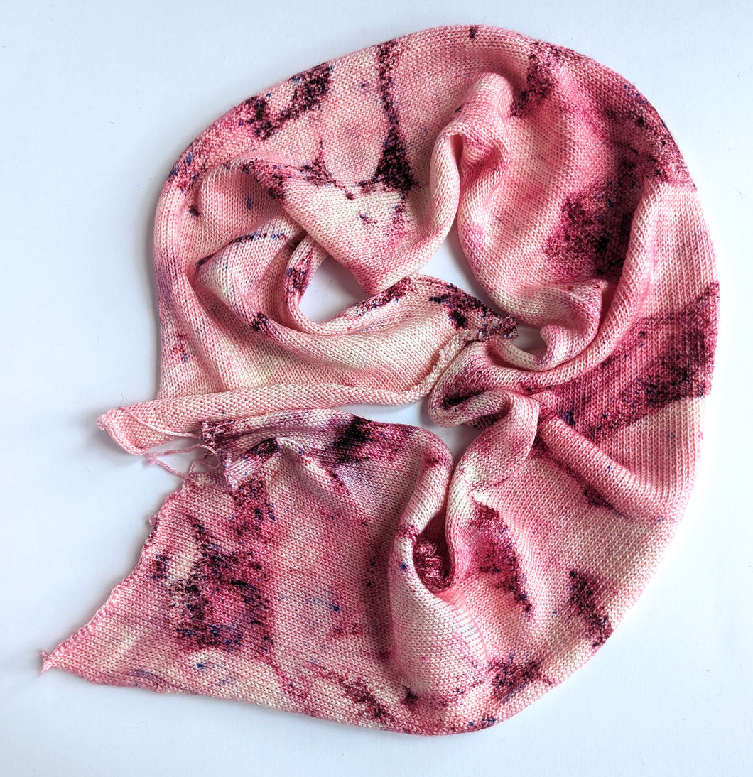 Superwash merino/silk 4ply blank, with pink speckles.